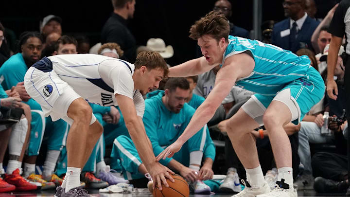 Dallas Mavericks forward Cooper Flagg (32) and Charlotte Hornets guard/forward Kon Knueppel (7) battle