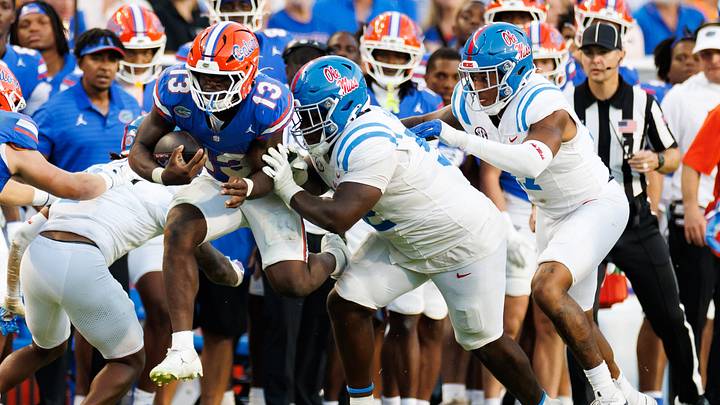 Sep 26, 2026; Gainesville, Florida, USA; Florida Gators running back Jadan Baugh (13) is pushed out of bounds by Mississippi Rebels defensive tackle Will Echoles (52) during the second half at Ben Hill Griffin Stadium. Mandatory Credit: Matt Pendleton-Imagn Images Sep 26, 2026; Gainesville, Florida, USA; Florida Gators running back Jadan Baugh (13) is pushed out of bounds by Mississippi Rebels defensive tackle Will Echoles (52) during the second half at Ben Hill Griffin Stadium. Mandatory Credit: Matt Pendleton-Imagn Images