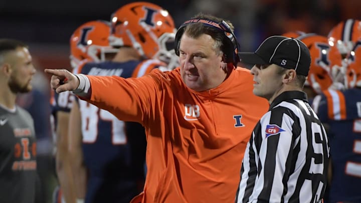 Oct 6, 2023; Champaign, Illinois, USA; Illinois Fighting Illini head coach Bret Bielema talks with an official during the first half against the Nebraska Cornhuskers at Memorial Stadium. Mandatory Credit: Ron Johnson-Imagn Images