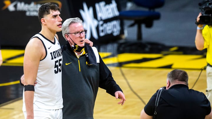 Iowa center Luka Garza walks with Iowa coach Fran McCaffery following a game against Penn State on Feb. 21, 2021. Iowa center Luka Garza walks with Iowa coach Fran McCaffery following a game against Penn State on Feb. 21, 2021.