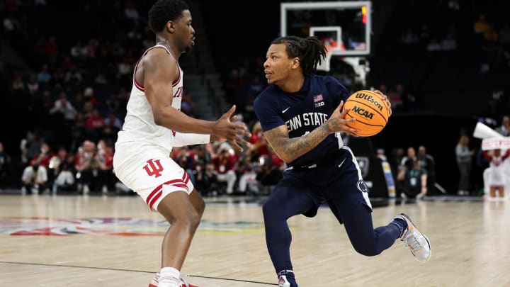 Penn State Nittany Lions guard Ace Baldwin Jr. dribbles around Indiana Hoosiers guard Xavier Johnson during the second half at Target Center. Penn State Nittany Lions guard Ace Baldwin Jr. dribbles around Indiana Hoosiers guard Xavier Johnson during the second half at Target Center.