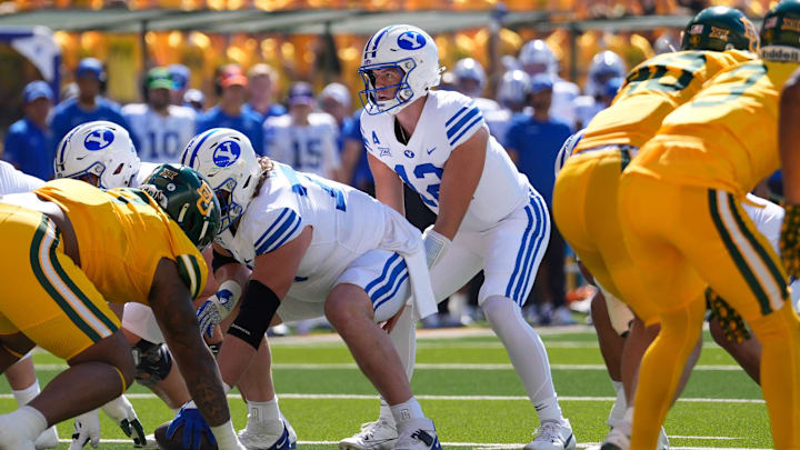 Sep 28, 2024; Waco, Texas, USA;  Brigham Young Cougars quarterback Jake Retzlaff (12) in action against the Baylor Bears during the first half at McLane Stadium. Mandatory Credit: Chris Jones-Imagn Images