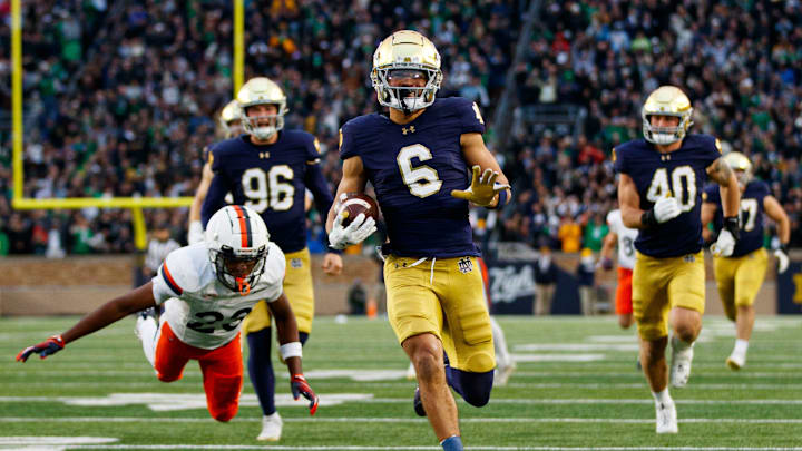 Notre Dame wide receiver Jordan Faison (6) runs the ball into the end zone for a touchdown on a fake punt play that would be later called back during a NCAA college football game against Virginia at Notre Dame Stadium on Saturday, Nov. 16, 2024, in South Bend.