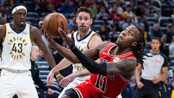 Jan 28, 2026; Indianapolis, Indiana, USA; Chicago Bulls guard Ayo Dosunmu (11) shoots the ball while Indiana Pacers guard T.J. McConnell (9) defends in the first half at Gainbridge Fieldhouse. Mandatory Credit: Trevor Ruszkowski-Imagn Images Jan 28, 2026; Indianapolis, Indiana, USA; Chicago Bulls guard Ayo Dosunmu (11) shoots the ball while Indiana Pacers guard T.J. McConnell (9) defends in the first half at Gainbridge Fieldhouse. Mandatory Credit: Trevor Ruszkowski-Imagn Images
