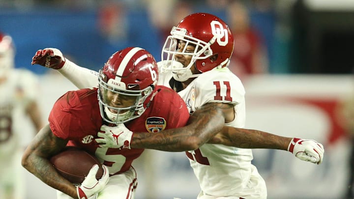 Oklahoma cornerback Parnell Motley (11) brings down Alabama wide receiver DeVonta Smith (6) during the Tide's 45-34 win in the 2018 College Football Playoff Semifinal at the Capitol One Orange Bowl in Miami Gardens, Florida Saturday, Dec. 29, 2018. [Staff Photo/Gary Cosby Jr.]

College Football Playoff Alabama Vs Oklahoma