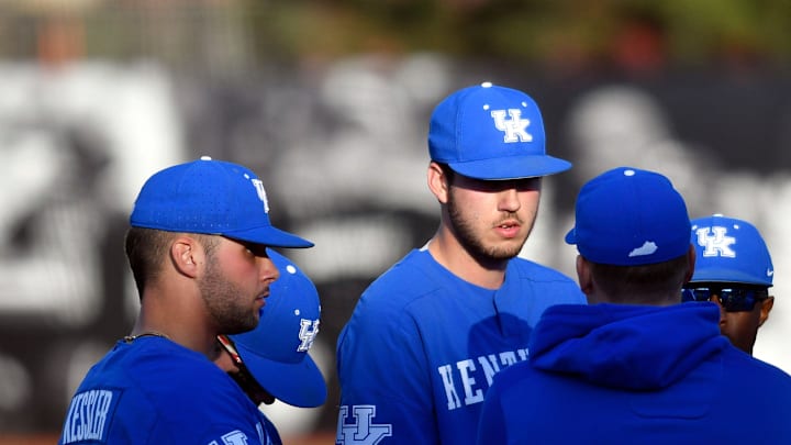 Kentucky head coach Nick Mingione talks with pitcher Mason Hazelwood at a conference during their game against Louisville at Jim Patterson Stadium, Tuesday, Apr. 2, 2019 in Louisville Ky.

Kyloubaseball Tde010