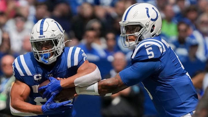 Indianapolis Colts quarterback Anthony Richardson (5) hands the ball off to Indianapolis Colts running back Jonathan Taylor (28) on Sunday, Sept. 8, 2024, during a game against the Houston Texans at Lucas Oil Stadium in Indianapolis.