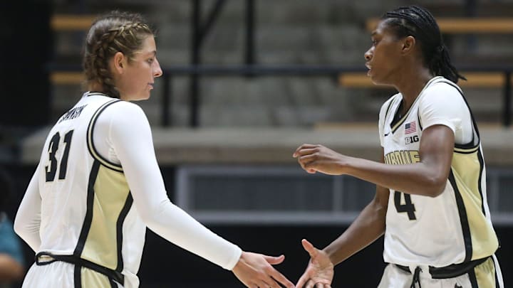 Purdue Boilermakers guard Sophie Swanson (31) high-fives guard Destini Lombard (4) 