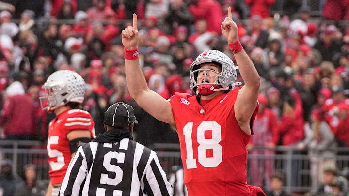 Ohio State Buckeyes quarterback Will Howard (18) celebrates a touchdown during the first half of the NCAA football game against the Indiana Hoosiers at Ohio Stadium in Columbus on Saturday, Nov. 23, 2024.