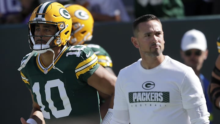 Sep 29, 2024; Green Bay, Wisconsin, USA;  Green Bay Packers quarterback Jordan Love (10) and head coach Matt LaFleur walk onto the field before the game against the Minnesota Vikings at Lambeau Field. Mandatory Credit: William Glasheen/USA TODAY Network via Imagn Images
