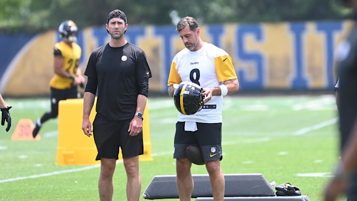 Jun 10, 2025; Pittsburgh, PA, USA;  Pittsburgh Steelers quarterback Aaron Rodgers (8) puts on his helmet during minicamp at their South Side facility. Mandatory Credit: Philip G. Pavely-Imagn Images