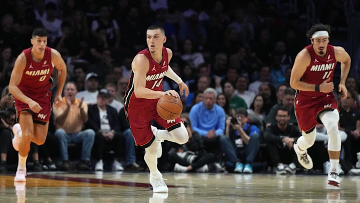 Nov 24, 2025; Miami, Florida, USA; Miami Heat guard Tyler Herro (14) brings the ball up the court against the Dallas Mavericks in the first half at Kaseya Center. Mandatory Credit: Jim Rassol-Imagn Images