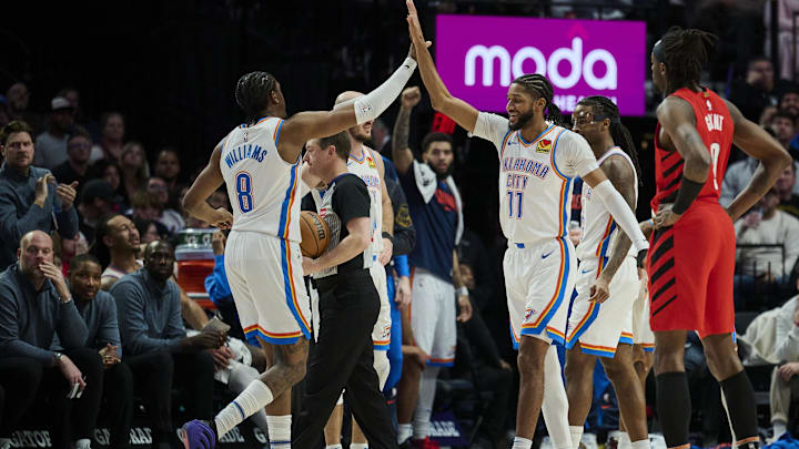 Jan 26, 2025; Portland, Oregon, USA; Oklahoma City Thunder forward Jalen Williams (8) and guard Isaiah Joe (11) high five during a break in the second half against the Portland Trail Blazers at Moda Center. Mandatory Credit: Troy Wayrynen-Imagn Images