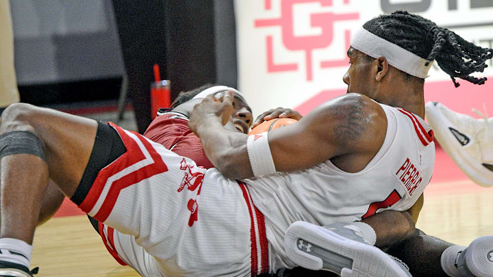 Jax StateÕs Jaron Pierre Jr. and New Mexico StateÕs JaeÕCoby Osborne scramble for a loose ball during college basketball action in Jacksonville, Alabama February 20, 2025. Jax State fell to New Mexico State 61-52. (Dave Hyatt / Hyatt Media LLC) Jax StateÕs Jaron Pierre Jr. and New Mexico StateÕs JaeÕCoby Osborne scramble for a loose ball during college basketball action in Jacksonville, Alabama February 20, 2025. Jax State fell to New Mexico State 61-52. (Dave Hyatt / Hyatt Media LLC)