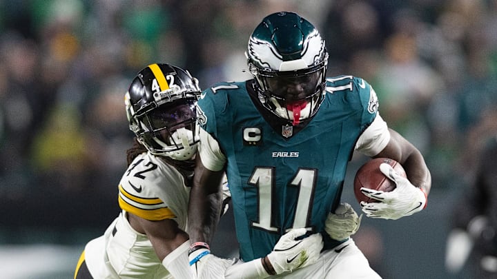 Dec 15, 2024; Philadelphia, Pennsylvania, USA; Philadelphia Eagles wide receiver A.J. Brown (11) runs with the ball against Pittsburgh Steelers cornerback James Pierre (42) after a catch during the fourth quarter at Lincoln Financial Field.