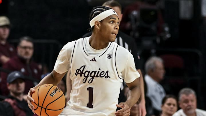 Feb 11, 2025; College Station, Texas, USA; Texas A&M Aggies guard Zhuric Phelps (1) dribbles the ball during the second half against the Georgia Bulldogs at Reed Arena. Mandatory Credit: Maria Lysaker-Imagn Images 