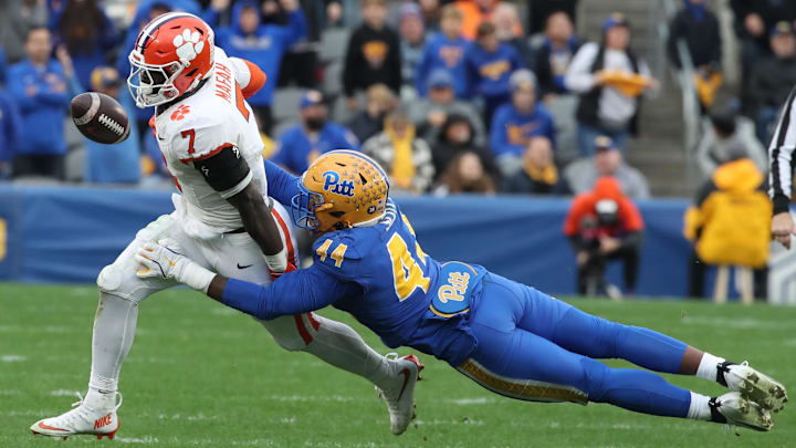 Nov 16, 2024; Pittsburgh, Pennsylvania, USA;  Pittsburgh Panthers defensive lineman Jimmy Scott (44) forces Clemson Tigers running back Phil Mafah (7) to fumble during the fourth quarter at Acrisure Stadium. Mandatory Credit: Charles LeClaire-Imagn Images