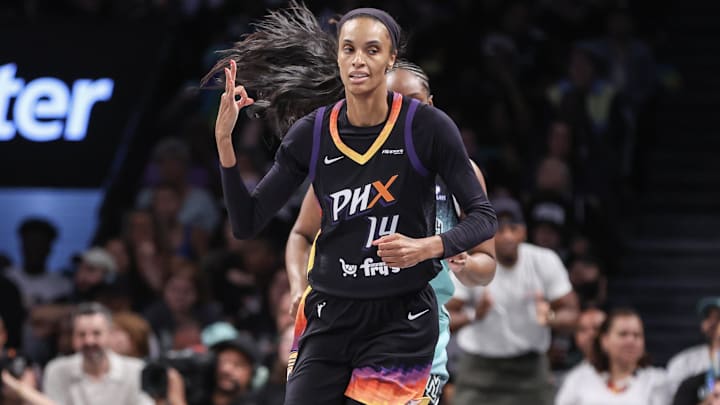 Jul 25, 2025; Brooklyn, New York, USA;  Phoenix Mercury forward DeWanna Bonner (14) gestures after making a three-point shot in the second quarter against the New York Liberty at Barclays Center. Mandatory Credit: Wendell Cruz-Imagn Images