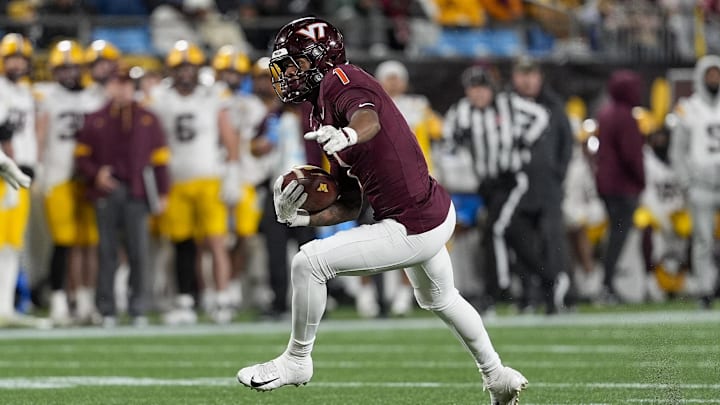 Jan 3, 2025; Charlotte, NC, USA; Virginia Tech Hokies cornerback Dante Lovett (1)  runs after his interception against the Minnesota Golden Gophers during the second half at the Duke’s Mayo Bowl at Bank of America Stadium. Mandatory Credit: Jim Dedmon-Imagn Images