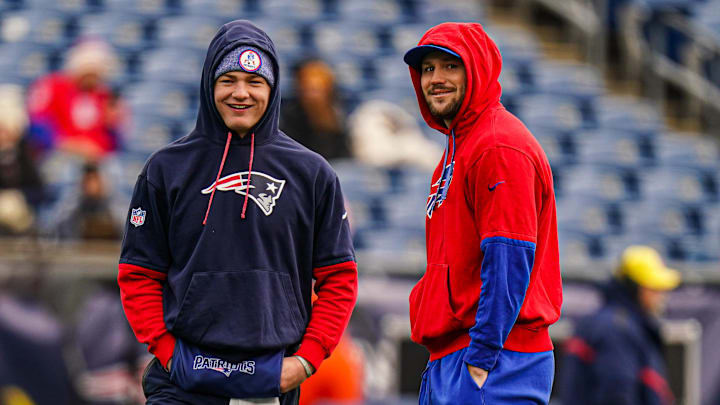 Jan 5, 2025; Foxborough, Massachusetts, USA; Buffalo Bills quarterback Josh Allen (17) and New England Patriots quarterback Drake Maye (10) talk on the field before the start of the game