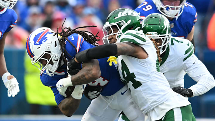 Dec 29, 2024; Orchard Park, New York, USA; New York Jets linebacker Jamien Sherwood (44) makes a tackle on Buffalo Bills running back James Cook (4) in the second quarter at Highmark Stadium. Mandatory Credit: Mark Konezny-Imagn Images Dec 29, 2024; Orchard Park, New York, USA; New York Jets linebacker Jamien Sherwood (44) makes a tackle on Buffalo Bills running back James Cook (4) in the second quarter at Highmark Stadium. Mandatory Credit: Mark Konezny-Imagn Images