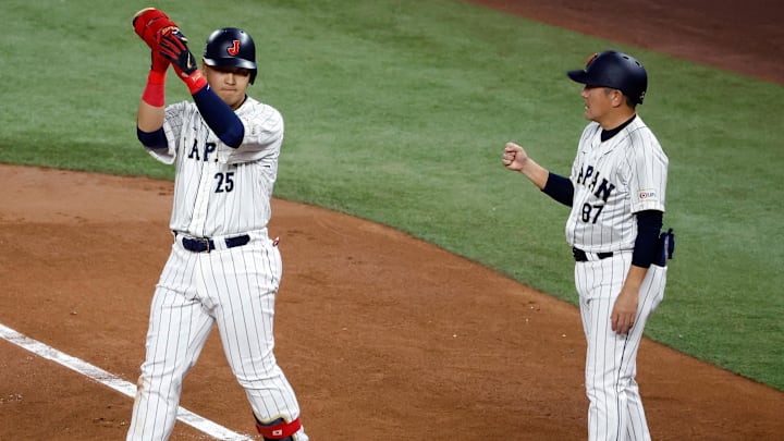 Mar 21, 2023; Miami, Florida, USA; Japan first baseman Kazuma Okamoto (25) singles against the USA in the second inning at LoanDepot Park. Mandatory Credit: Rhona Wise-Imagn Images Mar 21, 2023; Miami, Florida, USA; Japan first baseman Kazuma Okamoto (25) singles against the USA in the second inning at LoanDepot Park. Mandatory Credit: Rhona Wise-Imagn Images