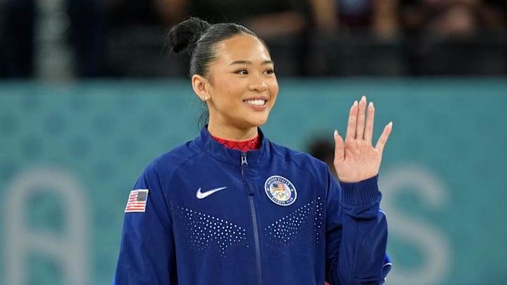 Sunisa Lee of the United States waves after winning the bronze medal on the second day of gymnastics event finals during the Paris 2024 Olympic Summer Games at Bercy Arena.