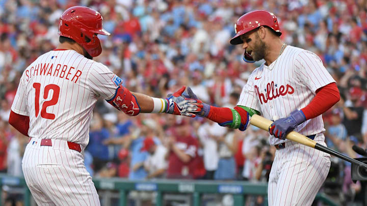 Aug 19, 2025; Philadelphia, Pennsylvania, USA; Philadelphia Phillies outfielder Kyle Schwarber (12) celebrates his home run with first base Bryce Harper (3) during the first inning against the Seattle Mariners at Citizens Bank Park. Aug 19, 2025; Philadelphia, Pennsylvania, USA; Philadelphia Phillies outfielder Kyle Schwarber (12) celebrates his home run with first base Bryce Harper (3) during the first inning against the Seattle Mariners at Citizens Bank Park.