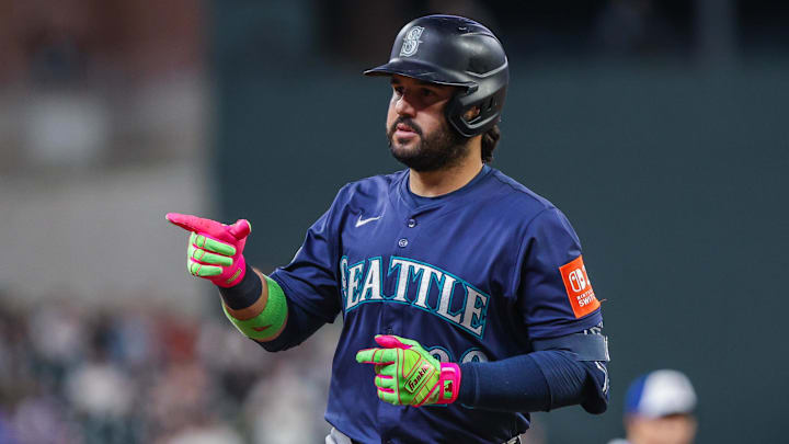 Sep 6, 2025; Cumberland, Georgia, USA; Seattle Mariners third base Eugenio Suarez (28) celebrates hitting a home run against the Atlanta Braves during the seventh inning at Truist Park. Mandatory Credit: Jordan Godfree-Imagn Images