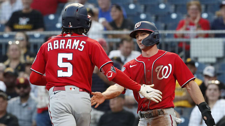 Sep 11, 2023; Pittsburgh, Pennsylvania, USA;  Washington Nationals center fielder Jacob Young (right) greets shortstop CJ Abrams (5) at home plate after a two run home run against the Pittsburgh Pirates during the third inning at PNC Park.