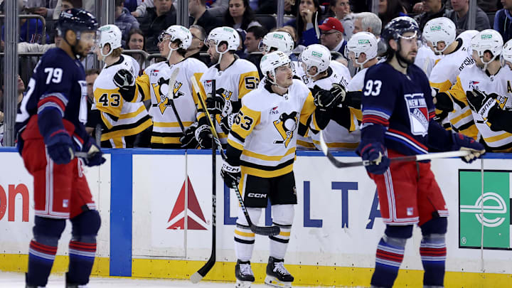 Feb 7, 2025; New York, New York, USA; Pittsburgh Penguins center Philip Tomasino (53) celebrates his goal against the New York Rangers with teammates during the second period at Madison Square Garden. Mandatory Credit: Brad Penner-Imagn Images