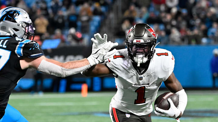 Tampa Bay Buccaneers running back Rachaad White (1) with the ball as Carolina Panthers linebacker Josey Jewell (47) defends in the fourth quarter at Bank of America Stadium. Tampa Bay Buccaneers running back Rachaad White (1) with the ball as Carolina Panthers linebacker Josey Jewell (47) defends in the fourth quarter at Bank of America Stadium.