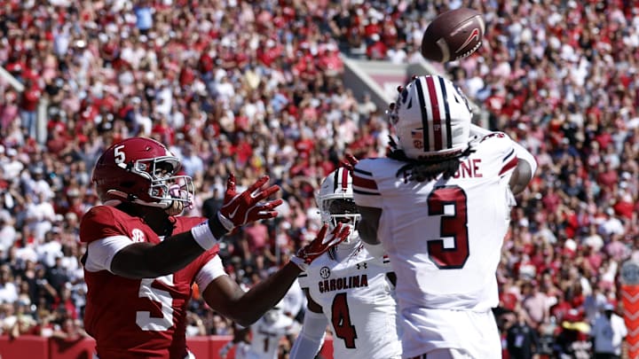 Oct 12, 2024; Tuscaloosa, Alabama, USA;  South Carolina Gamecocks defensive back O'Donnell Fortune (3) intercepts a pass intended for Alabama Crimson Tide wide receiver Germie Bernard (5) during the second half at Bryant-Denny Stadium. Mandatory Credit: Butch Dill-Imagn Images