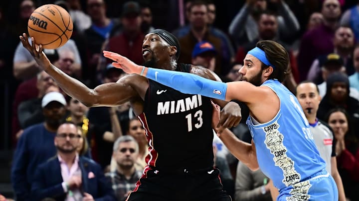 Mar 5, 2025; Cleveland, Ohio, USA; Cleveland Cavaliers guard Max Strus (1) defends Miami Heat center Bam Adebayo (13) during the second half at Rocket Arena. Mandatory Credit: Ken Blaze-Imagn Images