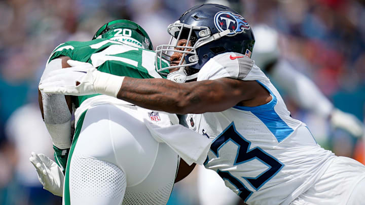 Tennessee Titans linebacker Ernest Jones IV (53) tackles New York Jets running back Breece Hall (20) during the first quarter at Nissan Stadium in Nashville, Tenn., Sunday, Sept. 15, 2024.