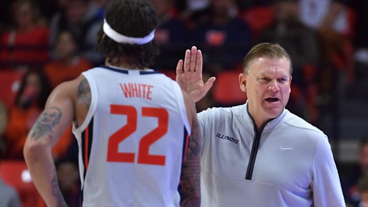 Nov 23, 2024; Champaign, Illinois, USA; Illinois Fighting Illini head coach Brad Underwood gives a hand to guard Tre White (22) during the second half against the Maryland-Eastern Shore Hawks at State Farm Center. Mandatory Credit: Ron Johnson-Imagn Images Nov 23, 2024; Champaign, Illinois, USA; Illinois Fighting Illini head coach Brad Underwood gives a hand to guard Tre White (22) during the second half against the Maryland-Eastern Shore Hawks at State Farm Center. Mandatory Credit: Ron Johnson-Imagn Images