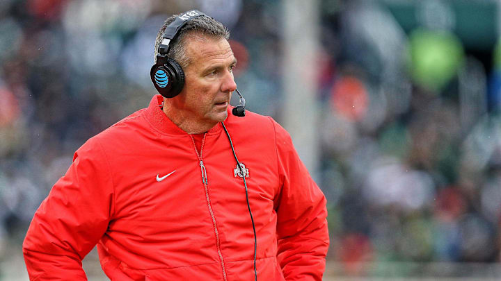 Nov 10, 2018; East Lansing, MI, USA; Ohio State Buckeyes head coach Urban Meyer stands on the sidelines during the second half of a game against the Michigan State Spartans at Spartan Stadium. Mandatory Credit: Mike Carter-Imagn Images