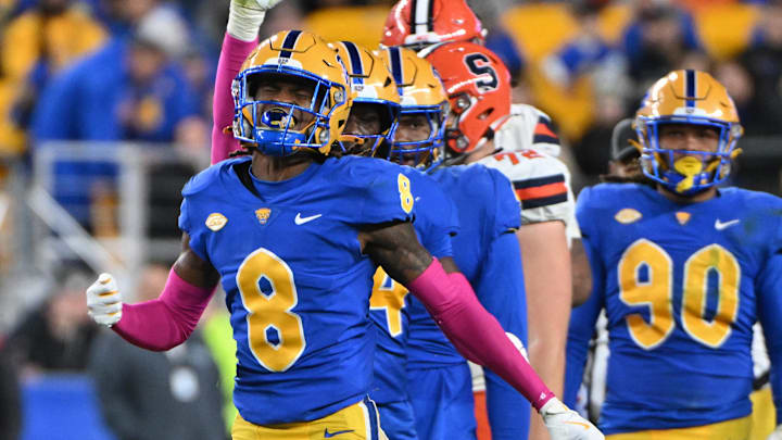 Oct 24, 2024; Pittsburgh, Pennsylvania, USA; Pittsburgh Panthers defensive back Tamon Lynum (8) celebrates a tackle of Syracuse Orange running back LeQuint Allen (1) during the third quarter at Acrisure Stadium. Mandatory Credit: Barry Reeger-Imagn Images