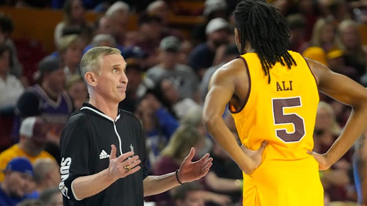 Arizona State head coach Bobby Hurley talks with freshman guard Amier Ali (5). 