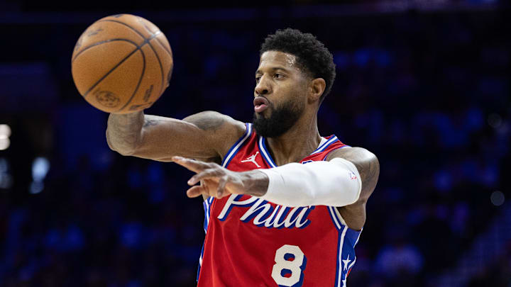 Jan 24, 2025; Philadelphia, Pennsylvania, USA; Philadelphia 76ers forward Paul George (8) passes the ball against the Cleveland Cavaliers during the second quarter at Wells Fargo Center. Mandatory Credit: Bill Streicher-Imagn Images