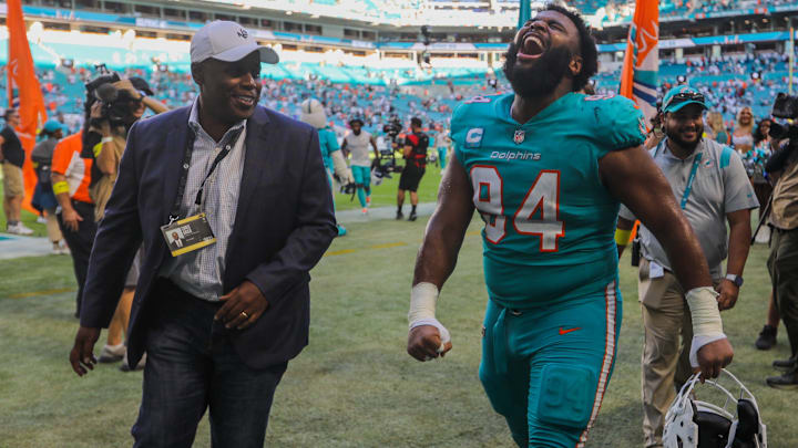 The Fins fired GM Chris Grier, left, on Halloween.
