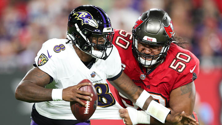 Oct 27, 2022; Tampa, Florida, USA;  Baltimore Ravens quarterback Lamar Jackson (8) is sacked by Tampa Bay Buccaneers defensive tackle Vita Vea (50) in the first quarter at Raymond James Stadium. Mandatory Credit: Nathan Ray Seebeck-Imagn Images