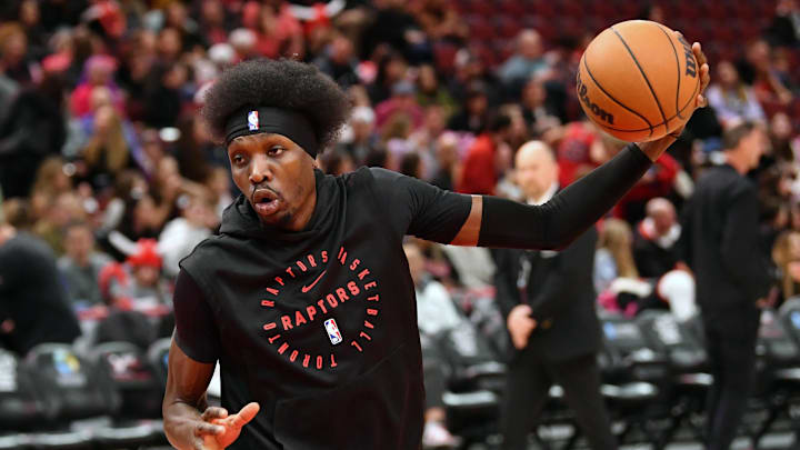 Feb 28, 2025; Chicago, Illinois, USA; Toronto Raptors forward Chris Boucher (25) warms up prior to a game against the Chicago Bulls at the United Center. Mandatory Credit: Patrick Gorski-Imagn Images