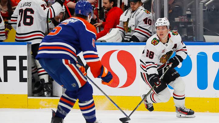 Apr 2, 2026; Edmonton, Alberta, CAN; Chicago Blackhawks forward Connor Bedard (98) looks to make a pass in front of Edmonton Oilers defensemen Connor Murphy (5) during the first period at Rogers Place. Mandatory Credit: Perry Nelson-Imagn Images
