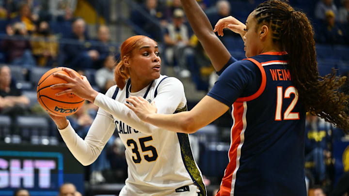 Cal center Sakima Walker looks to pass against Virginia