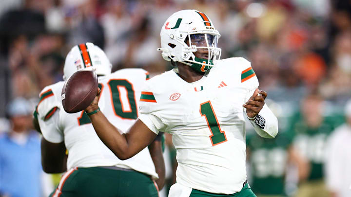 Sep 21, 2024; Tampa, Florida, USA; Miami Hurricanes quarterback Cam Ward (1) throws a pass against the South Florida Bulls in the third quarter at Raymond James Stadium. Mandatory Credit: Nathan Ray Seebeck-Imagn Images