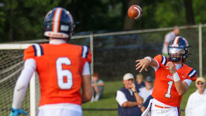 Harrison's Lannon Nicoloff (1) throws to Channing Glick (6) Friday, August 22, 2025, during the IHSAA football game against the West Lafayette Red Devils at Harrison High School in West Lafayette, Indiana.