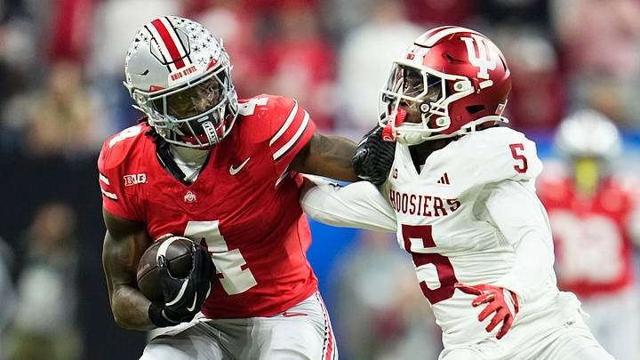 Ohio State Buckeyes wide receiver Jeremiah Smith (4) shakes off Indiana Hoosiers defensive back D'Angelo Ponds (5) during the Big Ten Conference championship game at Lucas Oil Stadium in Indianapolis on Dec. 6, 2025. Ohio State lost 13-10. Ohio State Buckeyes wide receiver Jeremiah Smith (4) shakes off Indiana Hoosiers defensive back D'Angelo Ponds (5) during the Big Ten Conference championship game at Lucas Oil Stadium in Indianapolis on Dec. 6, 2025. Ohio State lost 13-10.