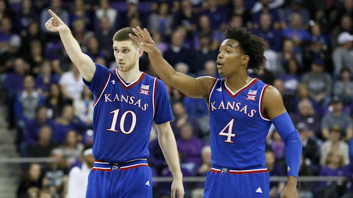 Jan 6, 2018; Fort Worth, TX, USA; Kansas Jayhawks guard Sviatoslav Mykhailiuk (10) and guard Devonte' Graham (4) react on the court in the second half against the TCU Horned Frogs at Ed and Rae Schollmaier Arena. Mandatory Credit: Tim Heitman-Imagn Images Jan 6, 2018; Fort Worth, TX, USA; Kansas Jayhawks guard Sviatoslav Mykhailiuk (10) and guard Devonte' Graham (4) react on the court in the second half against the TCU Horned Frogs at Ed and Rae Schollmaier Arena. Mandatory Credit: Tim Heitman-Imagn Images