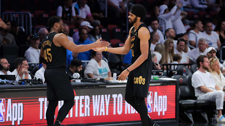 Apr 26, 2025; Miami, Florida, USA; Cleveland Cavaliers center Jarrett Allen (31) high-fives guard Donovan Mitchell (45) in the fourth quarter against the Miami Heat during game three for the first round of the 2025 NBA Playoffs at Kaseya Center. Mandatory Credit: Sam Navarro-Imagn Images Apr 26, 2025; Miami, Florida, USA; Cleveland Cavaliers center Jarrett Allen (31) high-fives guard Donovan Mitchell (45) in the fourth quarter against the Miami Heat during game three for the first round of the 2025 NBA Playoffs at Kaseya Center. Mandatory Credit: Sam Navarro-Imagn Images